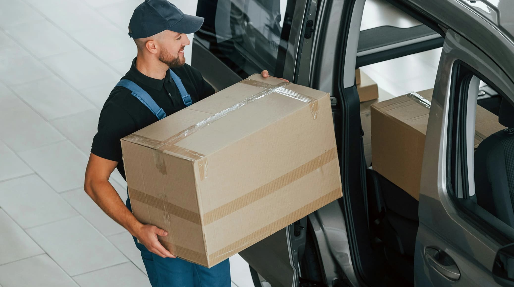 A LoadUp driver carrying a package