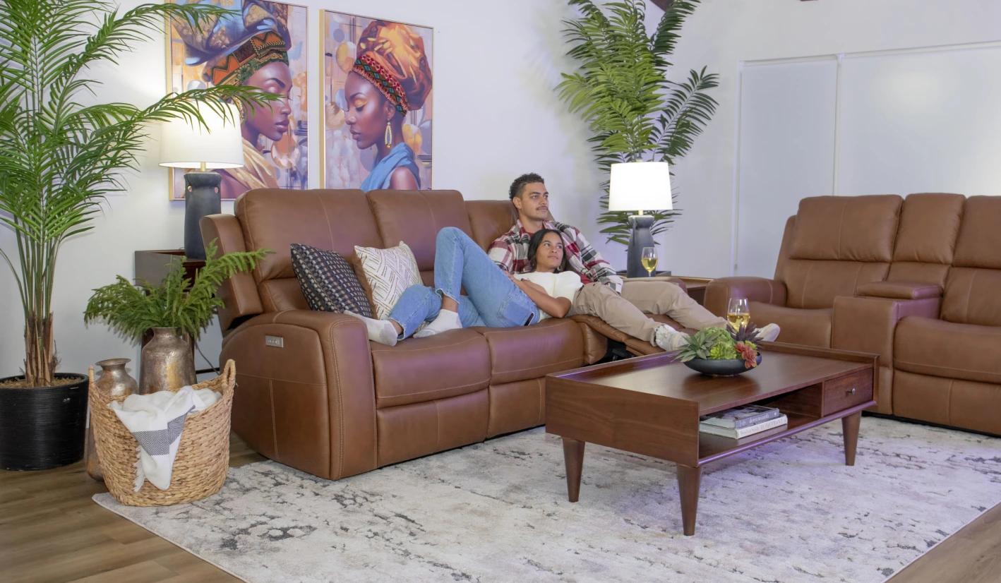 Two people sitting on couch