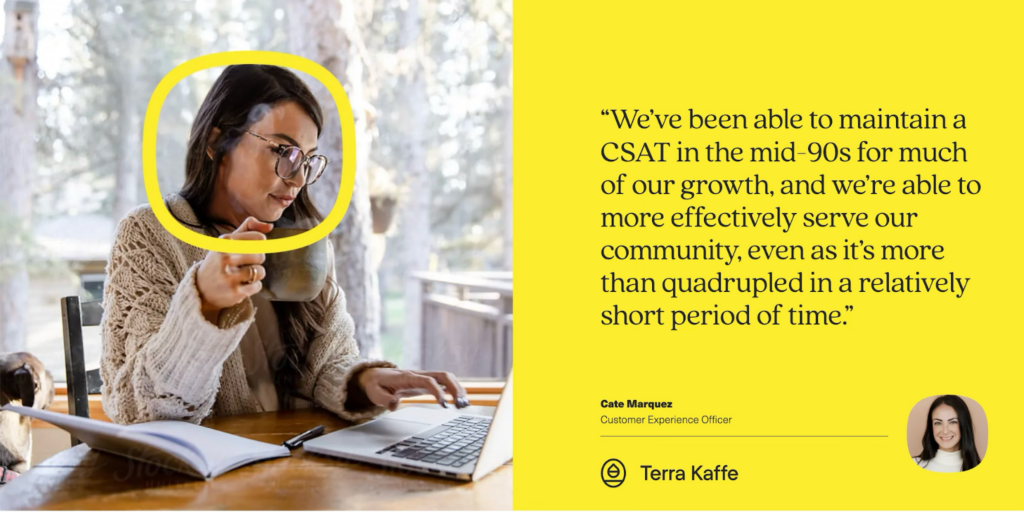 A woman with glasses sits at a table holding a mug and using her laptop, possibly drafting a blog or newsletter, with a notebook and pen beside her. A yellow section features a testimonial about CSAT growth from Cate Marquez, Terra Kaffes Customer Experience Officer.